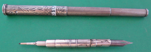 6280: UNBRANDED TELESCOPING, MACHINE ENGRAVED COMBO PEN & PENCIL. FOUNTAIN PEN HAS FLEXIBLE STEEL NIB.Unmarked, but possibly made of sterling, assumption from the appearance and patina